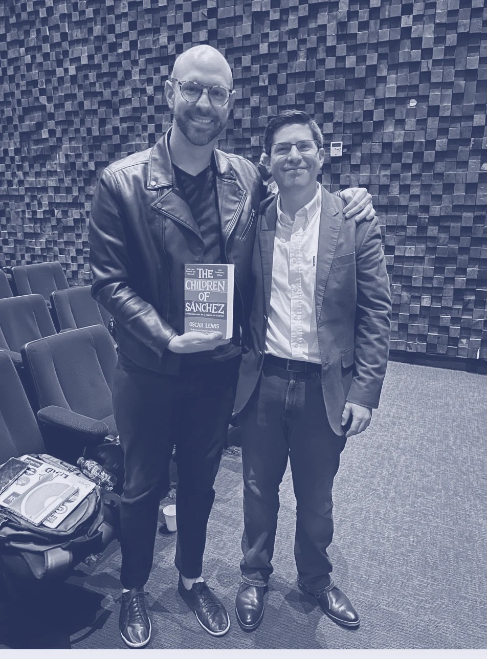 Alex Servin holding his book after the Google talk in Mexico City